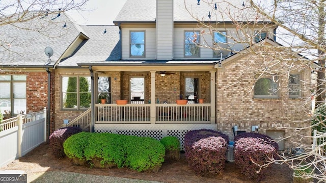 back of property with a porch