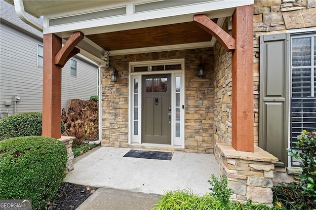 property entrance with covered porch