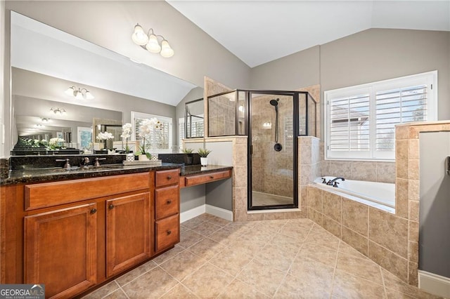 bathroom featuring tile patterned flooring, vanity, independent shower and bath, and lofted ceiling