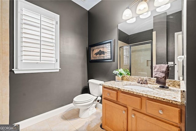 bathroom with tile patterned floors, toilet, vanity, and walk in shower