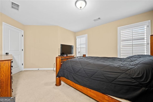 bedroom with light colored carpet