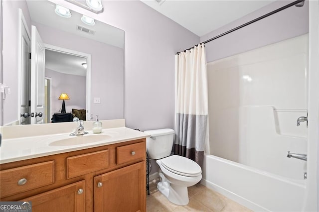 full bathroom with tile patterned floors, vanity, toilet, and shower / bath combo with shower curtain