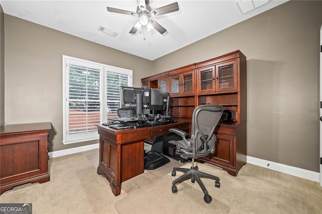 home office featuring ceiling fan and light carpet