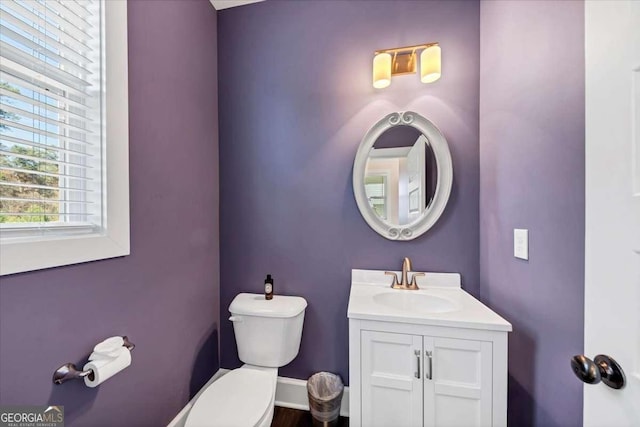 bathroom featuring vanity and toilet