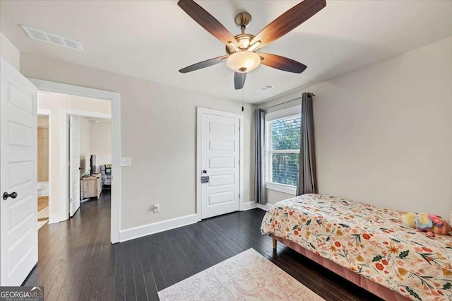 bedroom with dark hardwood / wood-style flooring and ceiling fan