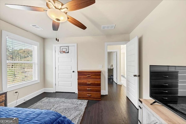 bedroom featuring ceiling fan and dark wood-type flooring