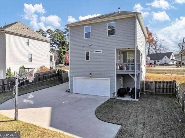 back of property with a garage