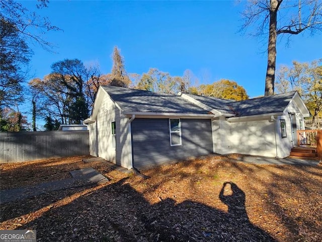 view of home's exterior with a wooden deck