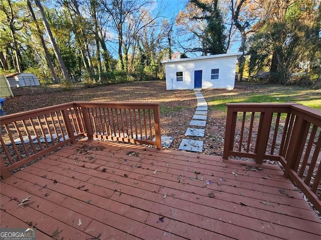 wooden terrace with an outdoor structure