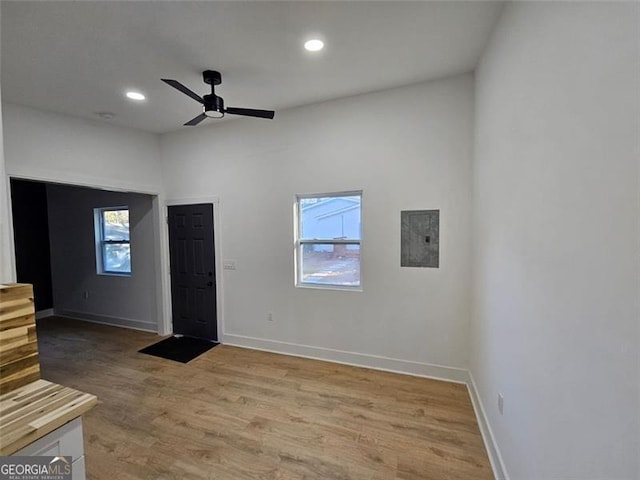 unfurnished room with ceiling fan and light wood-type flooring