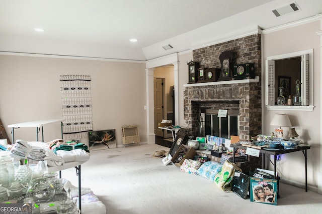 carpeted living room featuring ornamental molding, a fireplace, and vaulted ceiling