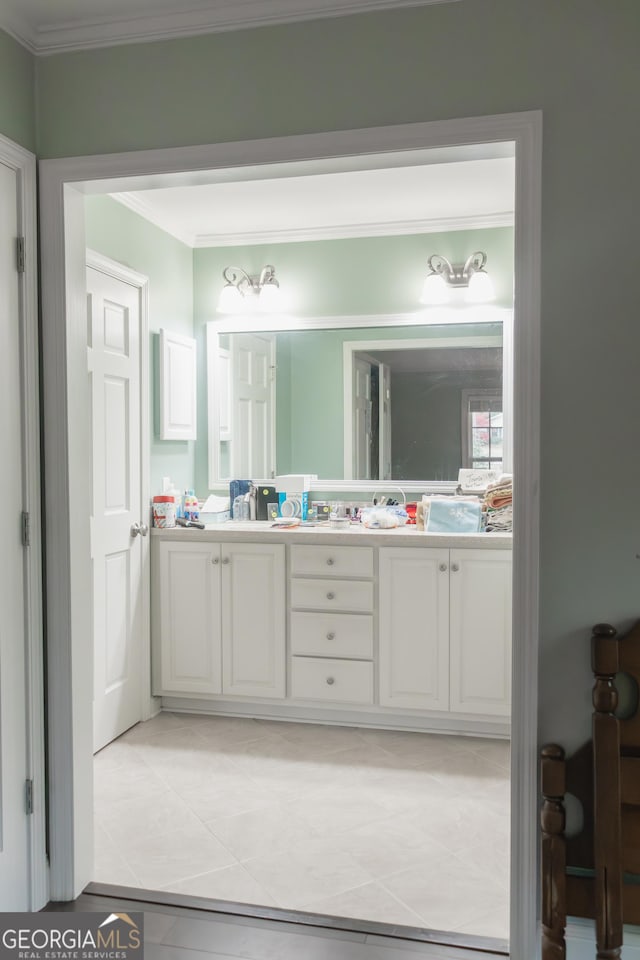 bathroom featuring tile patterned floors, vanity, and ornamental molding