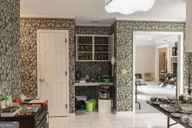 kitchen featuring ornamental molding and a chandelier