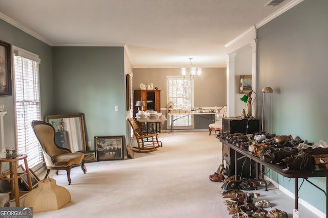 sitting room featuring carpet flooring, crown molding, and plenty of natural light