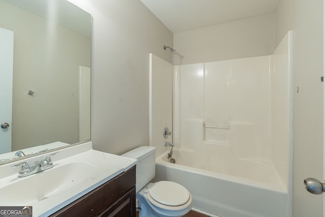 full bathroom featuring shower / tub combination, vanity, and toilet