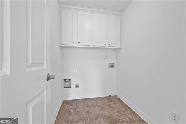 laundry area with cabinets, hookup for a washing machine, and electric dryer hookup