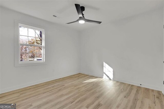 unfurnished room featuring ceiling fan and light wood-type flooring