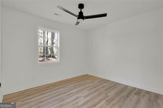 unfurnished room with ceiling fan and light wood-type flooring