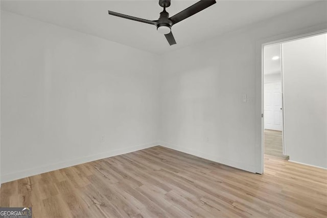 spare room with light hardwood / wood-style flooring and ceiling fan