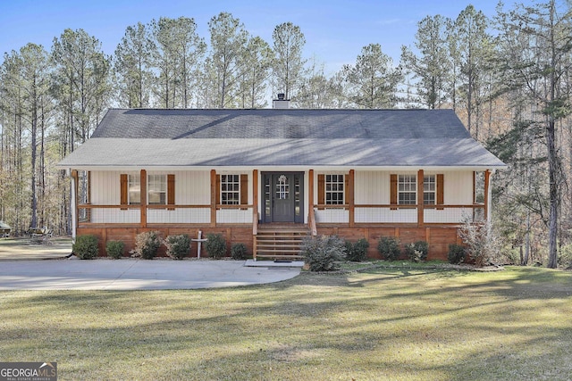 view of front of home with a porch and a front yard