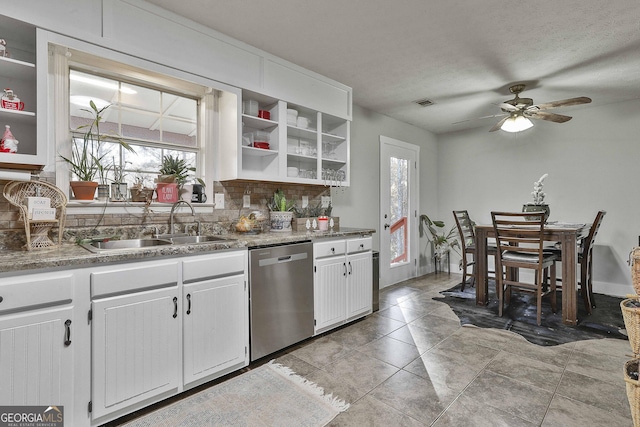 kitchen with white cabinetry, dishwasher, ceiling fan, sink, and decorative backsplash