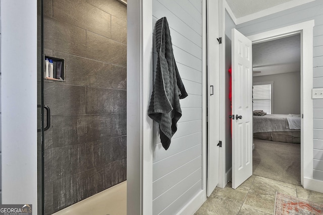 bathroom with wood walls and a shower