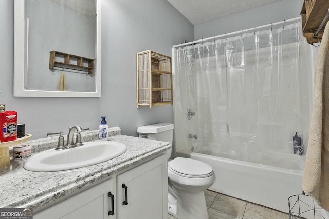 full bathroom featuring shower / bath combo, tile patterned floors, a textured ceiling, toilet, and vanity