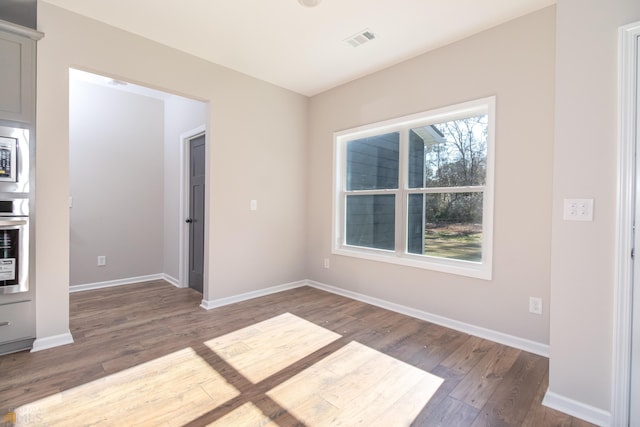 interior space with dark hardwood / wood-style floors