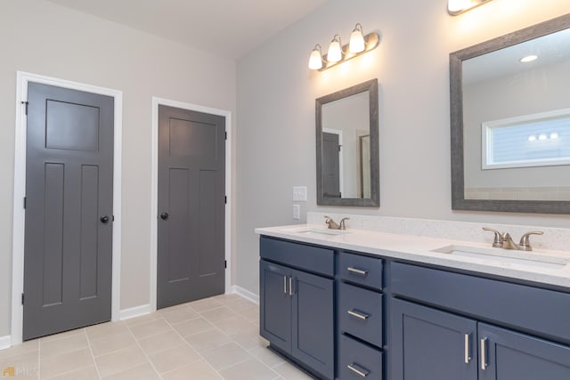 bathroom with tile patterned floors and vanity