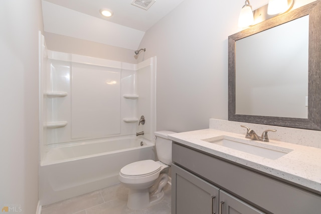 full bathroom with tile patterned floors, vanity, shower / washtub combination, toilet, and lofted ceiling