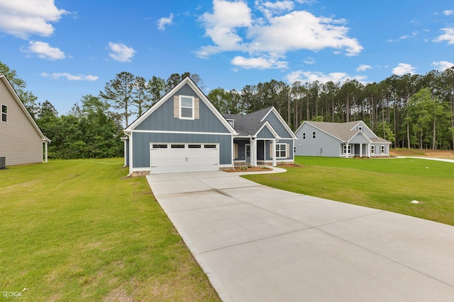 view of front of house with central AC unit, a garage, and a front lawn