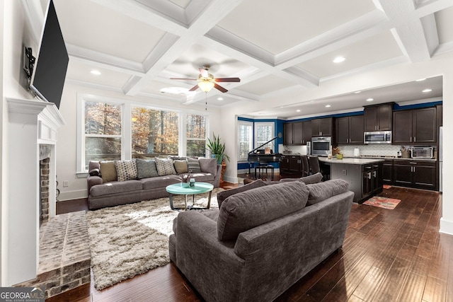 living room with beam ceiling, ceiling fan, dark hardwood / wood-style flooring, and coffered ceiling