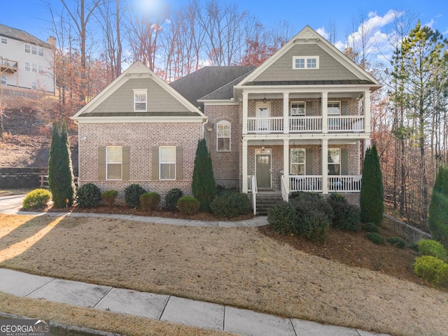 view of front of home featuring covered porch and a balcony