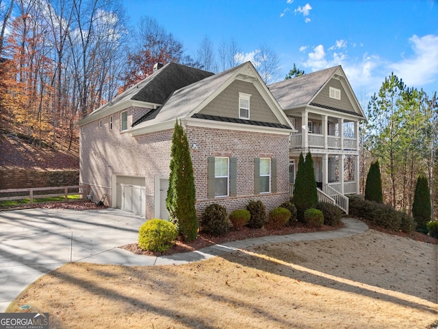 view of front of property with a balcony and a garage