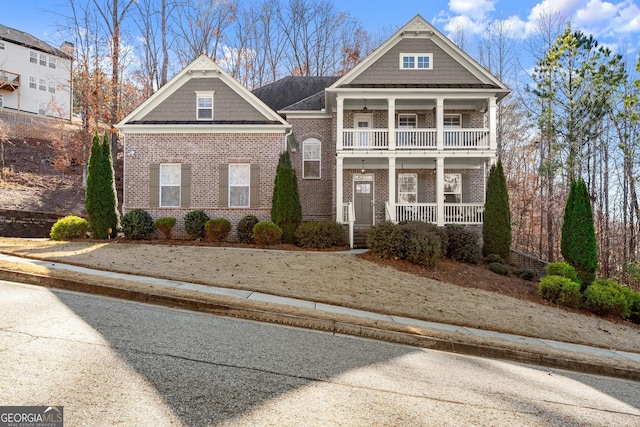 view of front of home with covered porch and a balcony