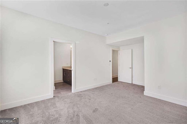 966 Moda Dr, Atlanta, GA 30316 - unfurnished bedroom with light colored carpet and connected bathroom