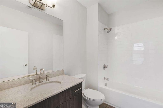 966 Moda Dr, Atlanta, GA 30316 - full bathroom featuring vanity, tiled shower / bath combo, and toilet