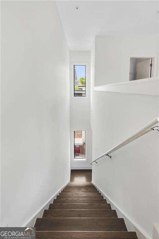 966 Moda Dr, Atlanta, GA 30316 - stairway featuring hardwood / wood-style flooring