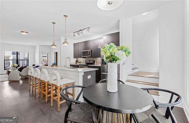966 Moda Dr, Atlanta, GA 30316 - dining space with sink and dark wood-type flooring