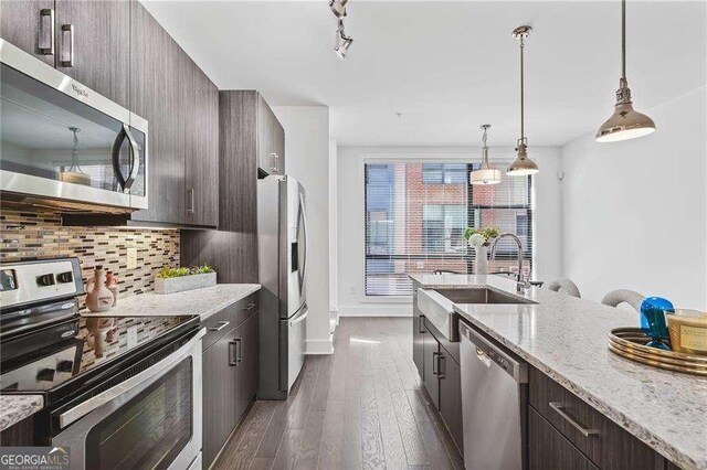 966 Moda Dr, Atlanta, GA 30316 - kitchen featuring dark brown cabinetry, stainless steel appliances, and sink