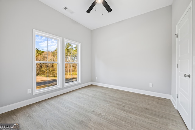 unfurnished room with light hardwood / wood-style flooring and ceiling fan