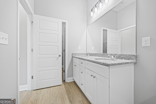 bathroom featuring vanity and hardwood / wood-style floors