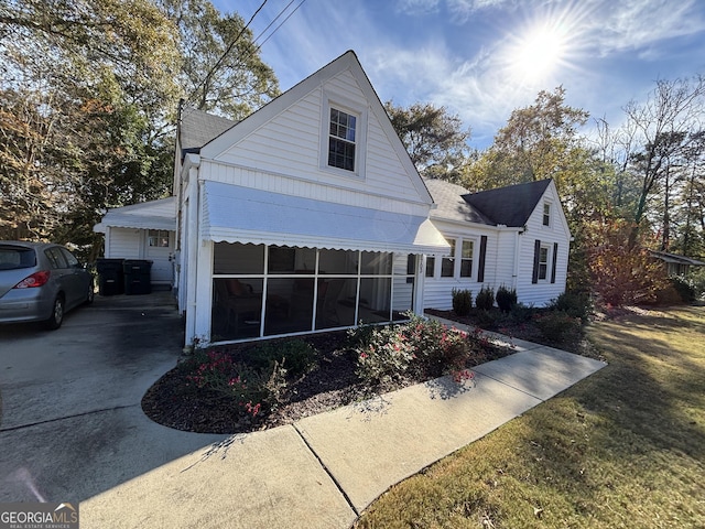 view of front of house featuring a sunroom