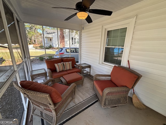 sunroom / solarium featuring ceiling fan