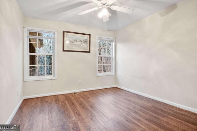 unfurnished room featuring ceiling fan and wood-type flooring