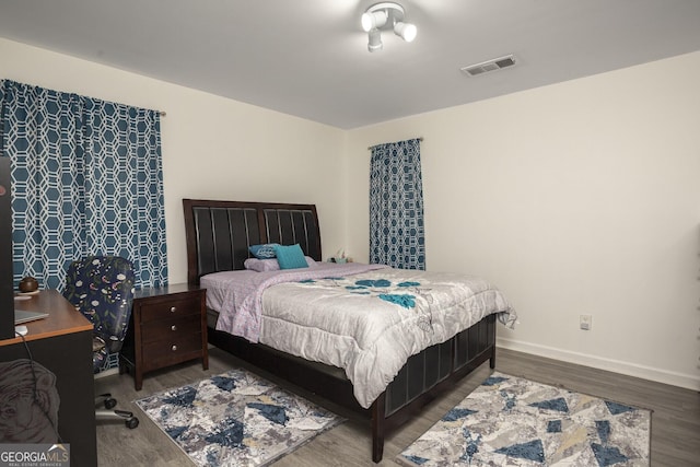 bedroom with hardwood / wood-style flooring