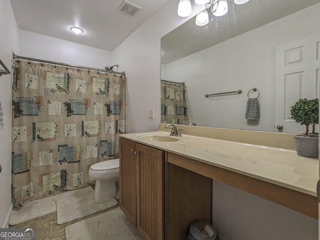 bathroom featuring vanity, curtained shower, and toilet