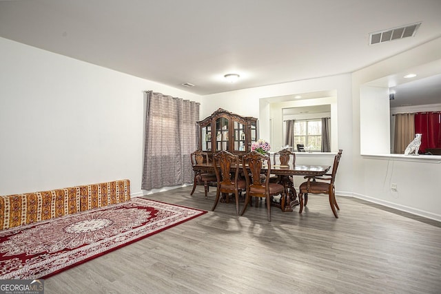 dining room featuring hardwood / wood-style flooring