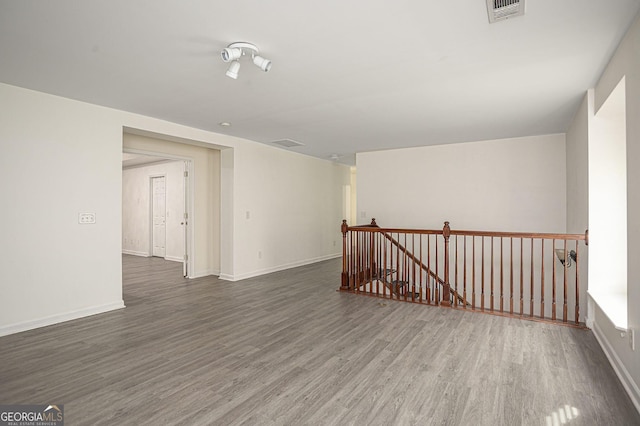 unfurnished room featuring hardwood / wood-style floors