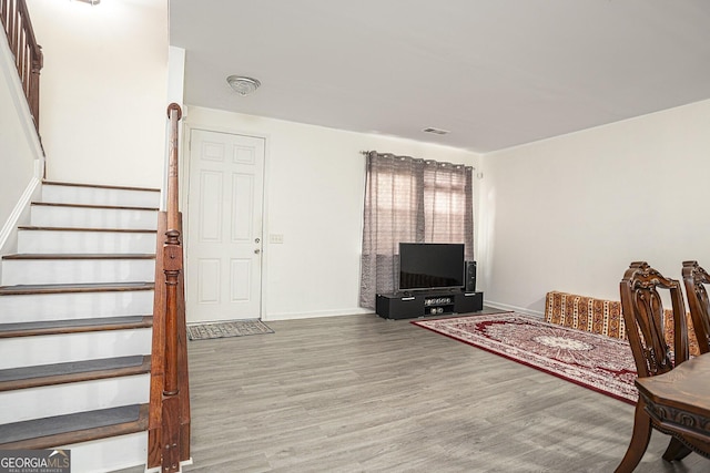 sitting room featuring wood-type flooring